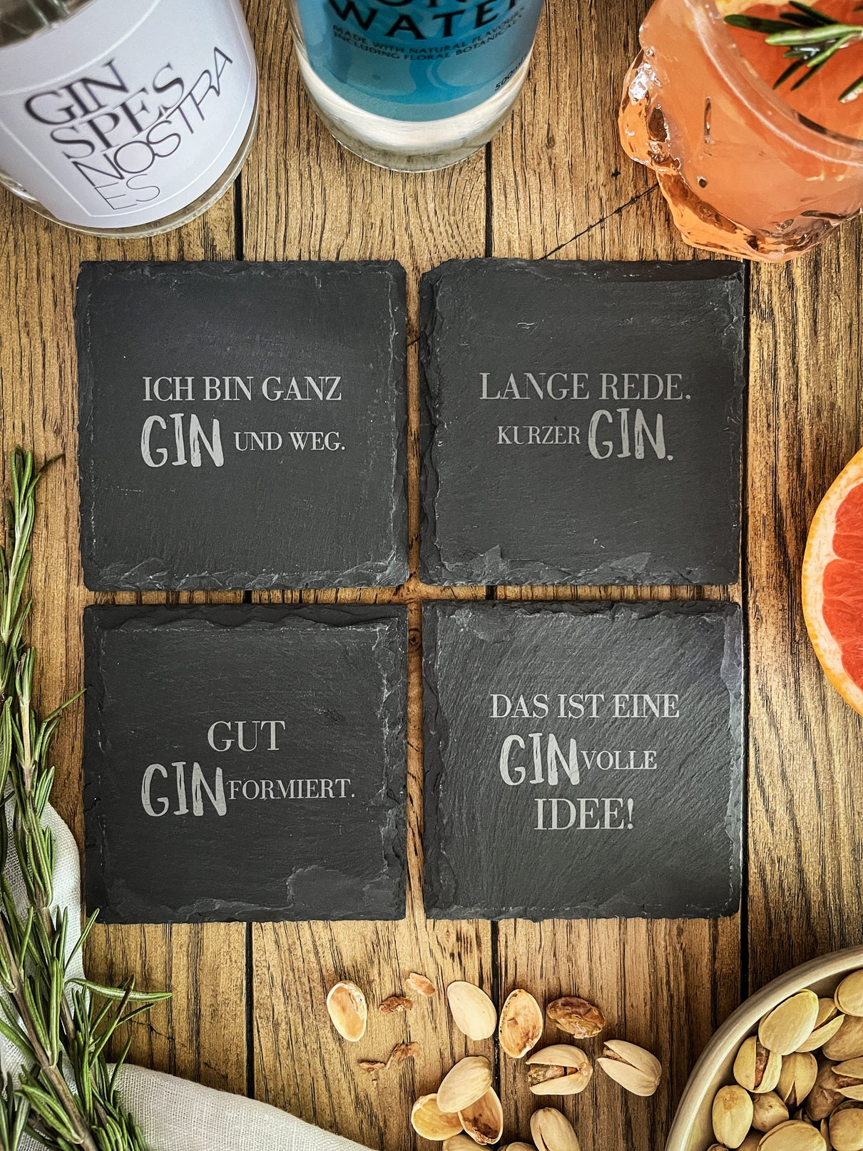 Gin-Untersetzer aus Schiefer mit versch. Motiven - 4er Set